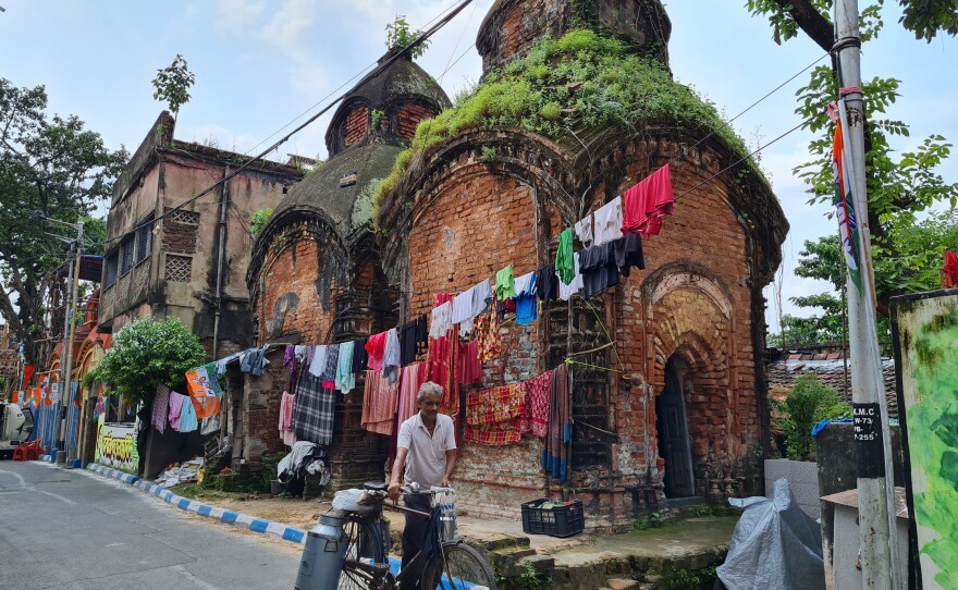 Flags of Mamata Banerjee's All India Trinamool Congress party alongside laundry hanging in Banerjee's own neighborhood in central Kolkata, India.
