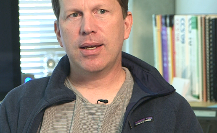 UC San Diego professor Stefan Savage discusses car hacking in his office, Oct. 22, 2015.