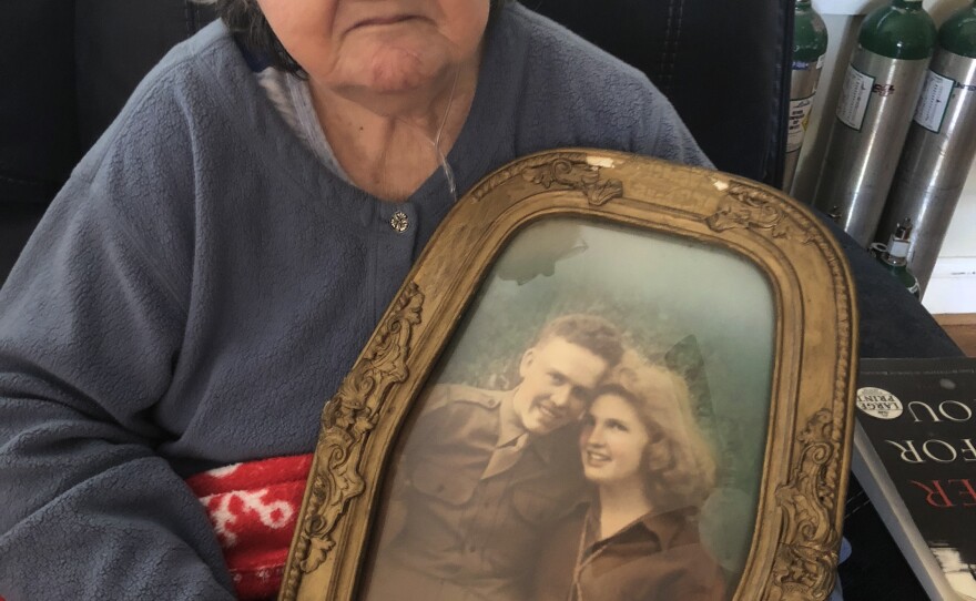 Christine Porter, 86, holds a portrait of her and her husband, Cpl. Kenneth F. Reese. He disappeared in North Korea just before Christmas 1950. Their daughter, Shelia Reese, was two months old when her father went missing.