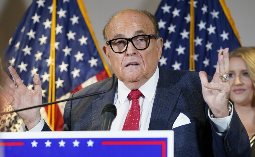 The New York State Bar Association is launching a "historic" inquiry into Trump attorney Rudolph Giuliani, shown here at a press conference last November.