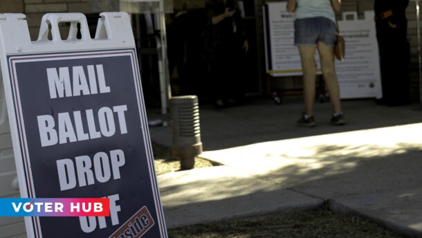 [PHOTO] A mail-in ballot drop-off location at the Lakeside branch of the San Diego County Library on Oct. 13, 2020 with the KPBS Voter Hub logo in the bottom left corner.