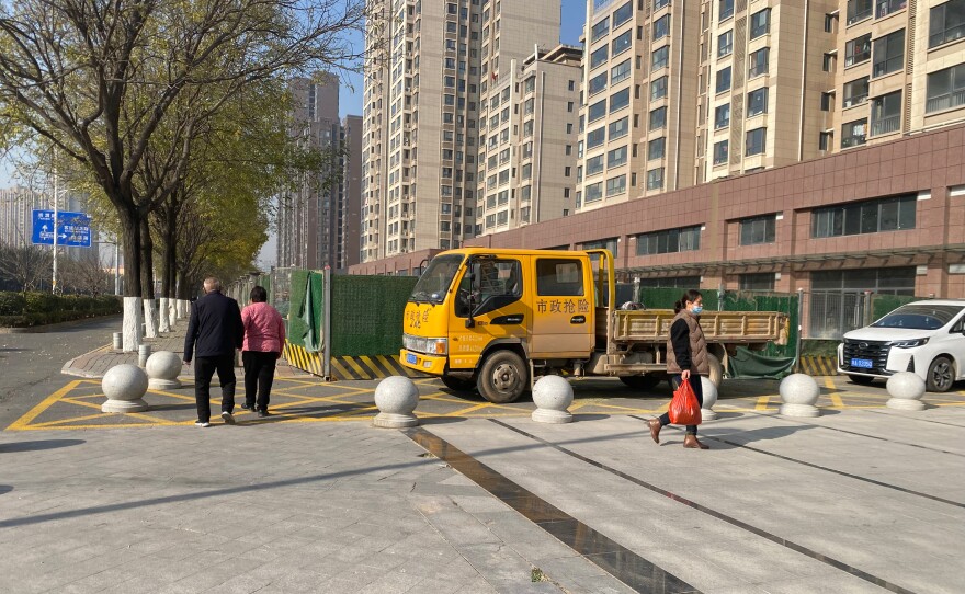 Outside the apartment complex where Lee Shin and his wife finally moved in after years of delay. Not long after Lee bought the unfinished apartment, construction stopped when the property developer allegedly lost money in other investments.
