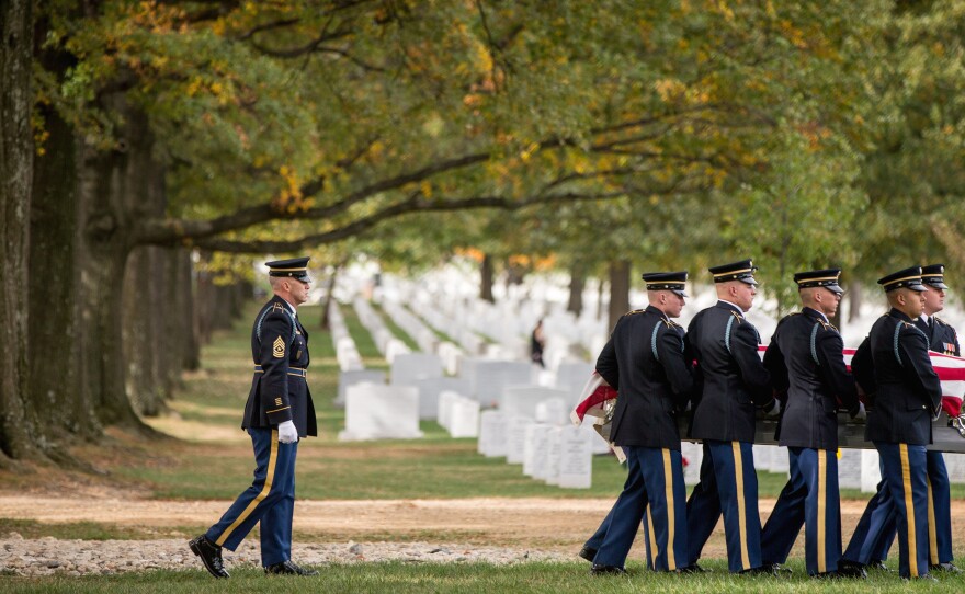 A casket team carries the remains of U.S. Army Cpl. Robert E. Meyers, a Korean War soldier, at Arlington National Cemetery in 2015. Meyers' remains were identified decades after his unit was involved in combat operations near Sonchu, North Korea.