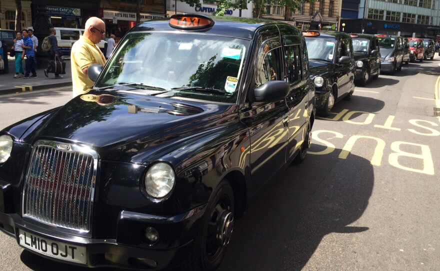 Traffic was snarled in London Wednesday as taxi drivers protested Uber by striking in the street.