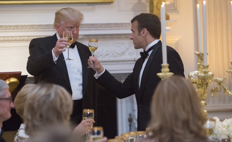 President Donald Trump shares a toast with French President Emmanuel Macron during a state dinner on April 24 at the White House.