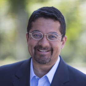 The image is an undated photograph of Shankar Vedantam, host of the "Hidden Brain" podcast.