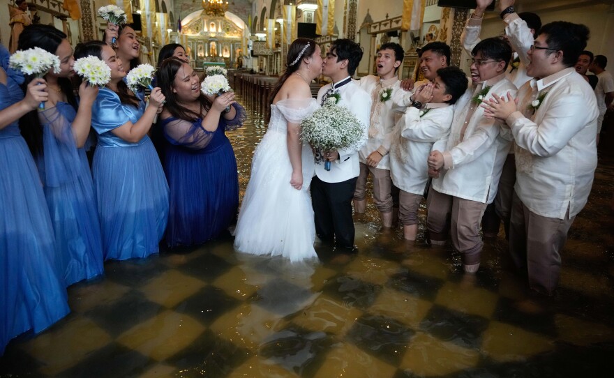 Newlyweds in the Philippines went ahead with their ceremony despite floods from Typhoon Wipha. Malolos, Bulacan province, Philippines. July 22, 2025.