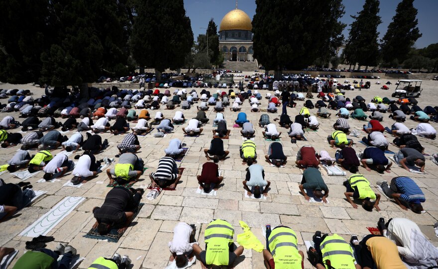 Muslim men practice social distancing during Friday prayers next to the Al-Aqsa Mosque in Jerusalem's Old City in July.