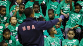Beijing Olympic decathlon gold medalist Bryan Clay talks to students during a World Sport Chicago sports camp in Chicago in April, when members of Chicago 2016 met with the International Olympic Committee Evaluation Commission.