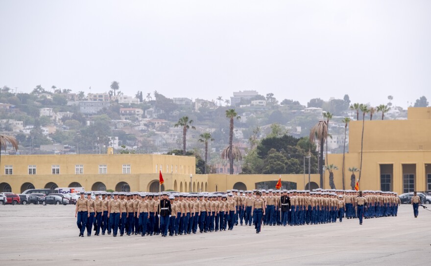 New Marines of Lima Company marching in formation during the graduation ceremony at Marine Corps Recruit Depot, May 6, 2021.