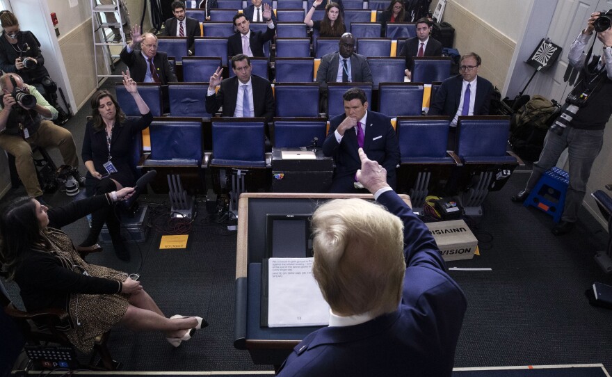 President Trump speaks about the coronavirus at the White House Tuesday.