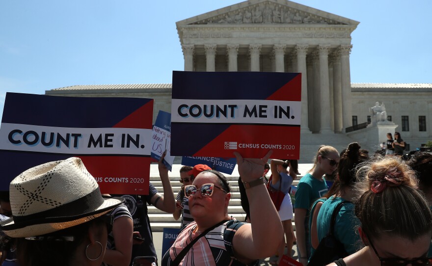 People gather in front of the U.S. Supreme Court last month as decisions are handed down, including on the census.