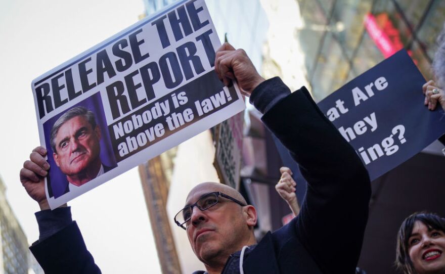 Activists participate in a Release the Report rally in Times Square on April 4 in New York City.