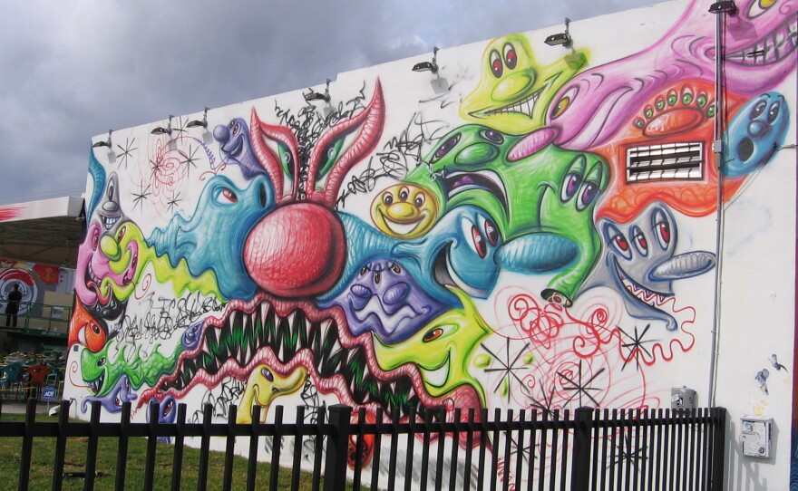 Los Angeles artist Kenny Scharf's cartoon-like mural greets visitors to Wynnwood Walls.