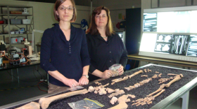 Kate Spradley, left, stands before the bones of a cadaver that's a subject of research in the Forensic Anthropology Center, Texas State University. Standing next to her is Michelle Hamilton. 