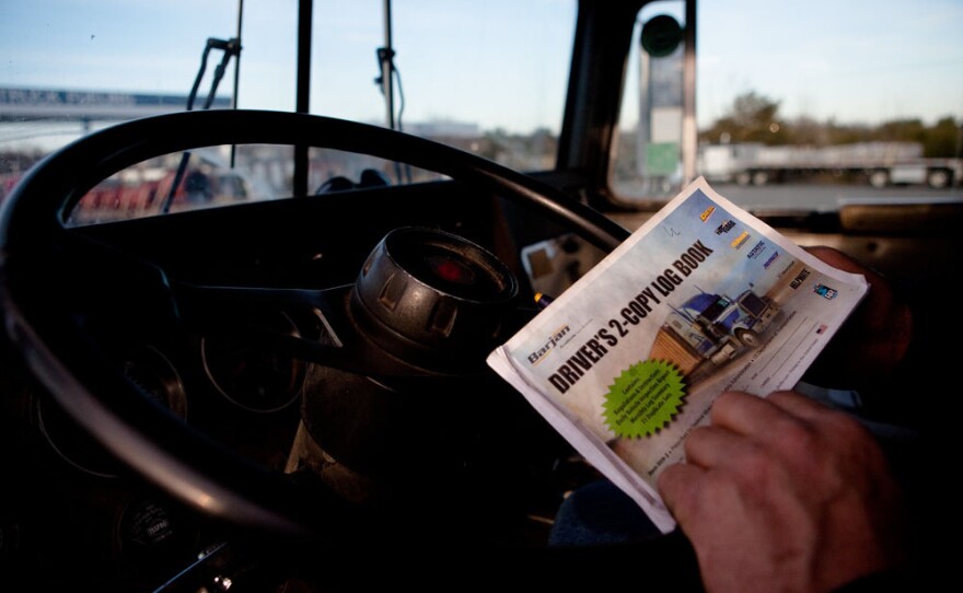 Paper log books, like this one used by trucker Terry Button, can be purchased at truck stops for as little as $1.49. Electronic monitors can cost more than $1,500.