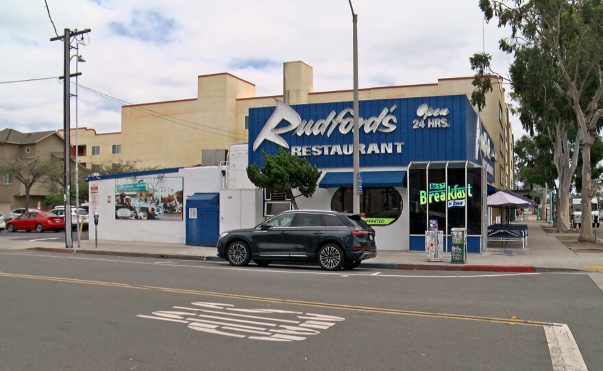 The picture of President Kennedy's motorcade is shown on the side of Rudford's Restaurant on El Cajon Boulevard.