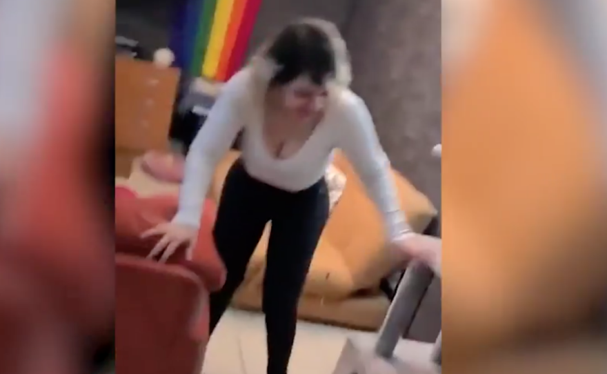 This video shows startled occupants of an apartment rush to steady themselves.