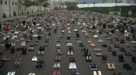 A display of 8,700 pairs of shoes, in all styles and sizes are displayed on 16th Street and Newton Avenue in downtown San Diego to represent the number of homeless men, women and children in the county, Aug. 25, 2015.