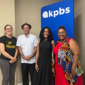 Katie Walkiewicz (left) and Chag Lowry, co-organizers of the inaugural Indigi-Con, stand next to KPBS Midday Edition host Jade Hindmon and Afrofuturism Lounge organizer LaWana Richmond (right) in the Midday Edition studio, July 22, 2025.