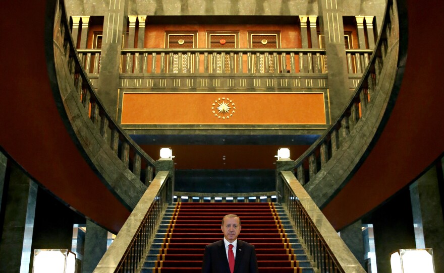 Erdogan stands in the newly built presidential palace in Ankara before the start of the 91st anniversary celebrations of the Turkish Republic on Oct 29.