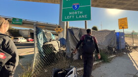 The Father Joe's Villages street health team visits an encampment near an I-5 onramp on Tuesday, Jan. 21, 2025.