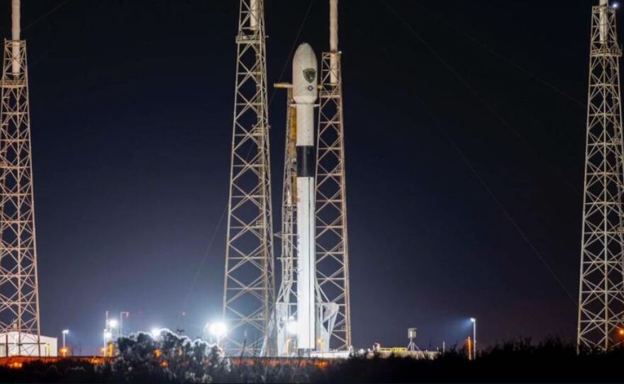 The SpaceX Falcon 9 rocket will carry a new GPS satellite into orbit around Earth. But Tuesday's launch was postponed.