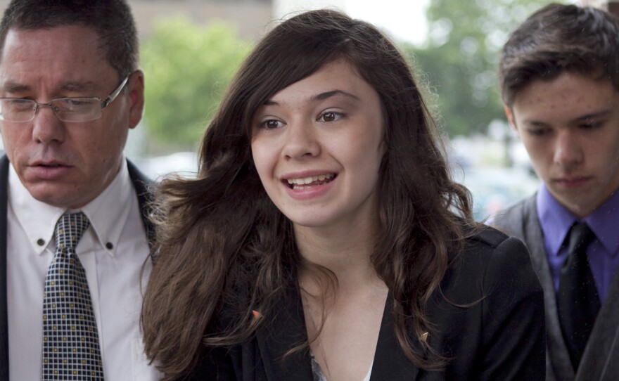 Transgender student Nicole Maines (accompanied by her father, Wayne, and her twin brother, Jonas) speaks to reporters after winning on appeal a discrimination lawsuit against her school district. In 2014, Glamour Magazine named Maines one of its 50 inspiring women of the year.