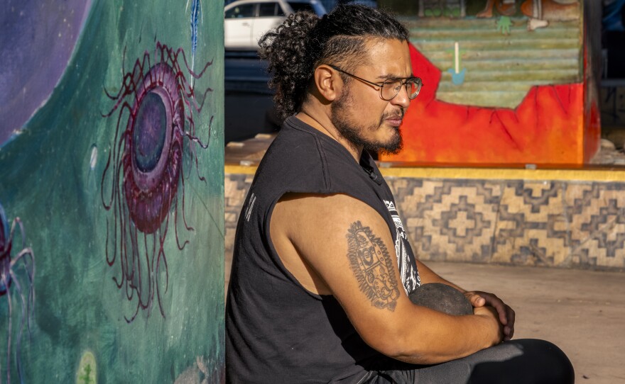 Eduardo Santiago directs the Fire Coyotes at Chicano Park on Friday, July 21, 2023.