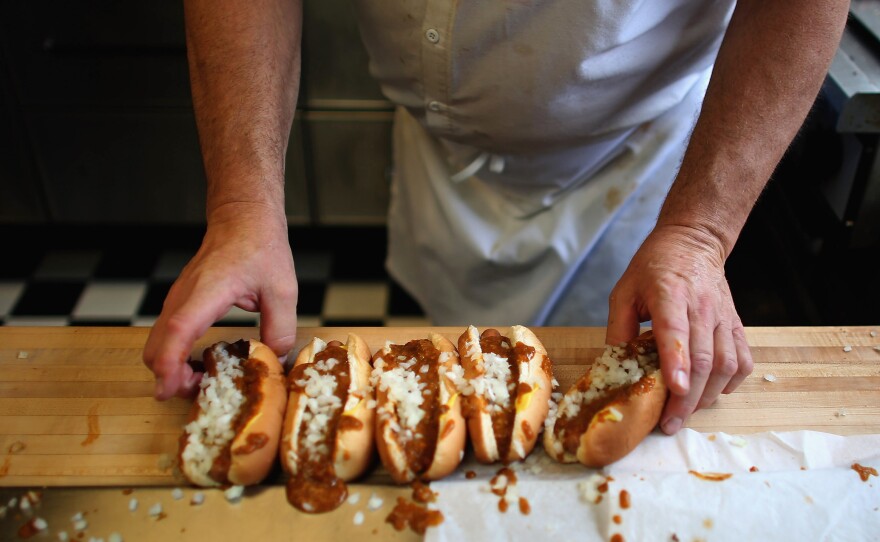 Rich Harlan prepares Coney hot dogs at his restaurant, Red Hots Coney Island, in Detroit.