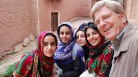 Rick Steves makes new friends in Iran. Welcoming travelers is a traditional Muslim value, and being American makes you the most popular kid in the village.