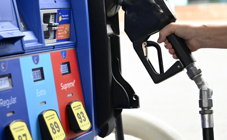 A person goes to the pump at a gas station in Arlington, Va., on July 29. The national average price of gasoline fell below $4 a gallon on Thursday.
