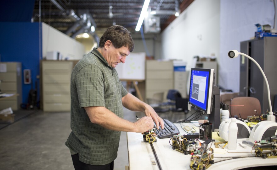 Taxi 2000 is a Minneapolis firm developing the SkyWeb Express system, a point-to-point personal rapid transit system. Here, company CEO Mike Lester works in the company's warehouse in Fridley, Minn.