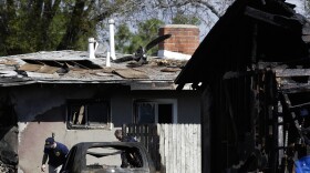 Investigators search the scene of a small plane crash in Riverside, Calif., on Tuesday, Feb. 28, 2017.