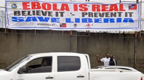 A banner adorns a street as the deadly Ebola virus spread in Monrovia, Liberia, Aug. 9, 2014.