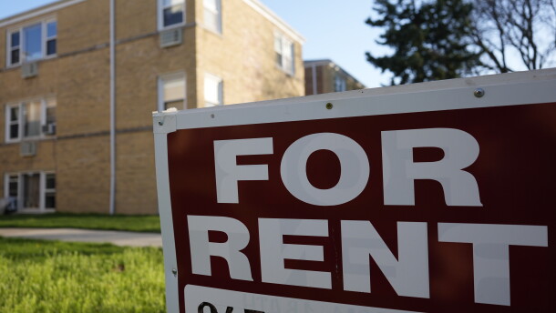 A "For Rent" sign displays outside an apartment building in Skokie, Ill., in 2024.  Researchers from the Urban Institute found that a growing number of renters in the U.S. are struggling to pay for housing each month.
