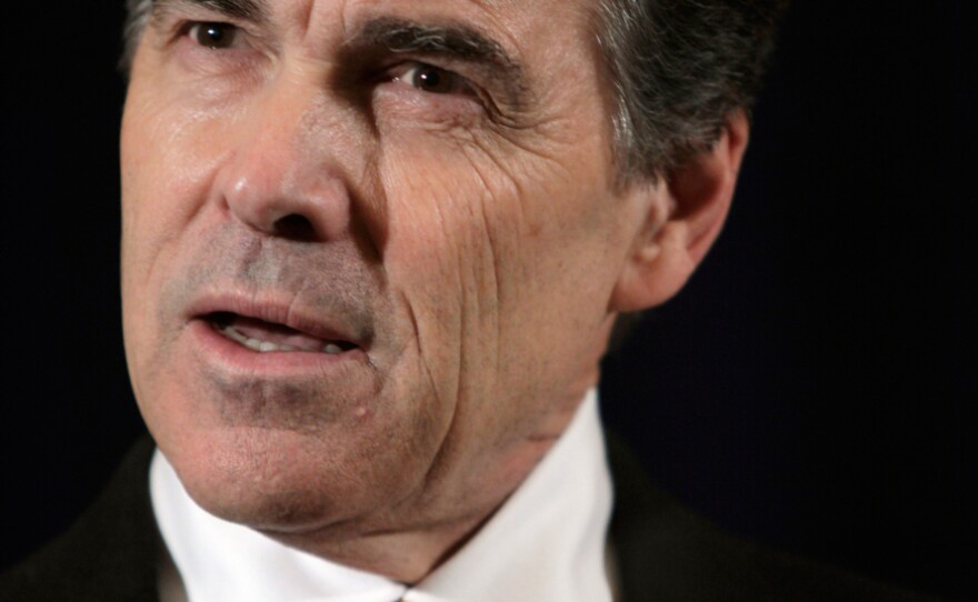 Republican presidential candidate Rick Perry speaks about Israel during a news conference in New York on Tuesday.