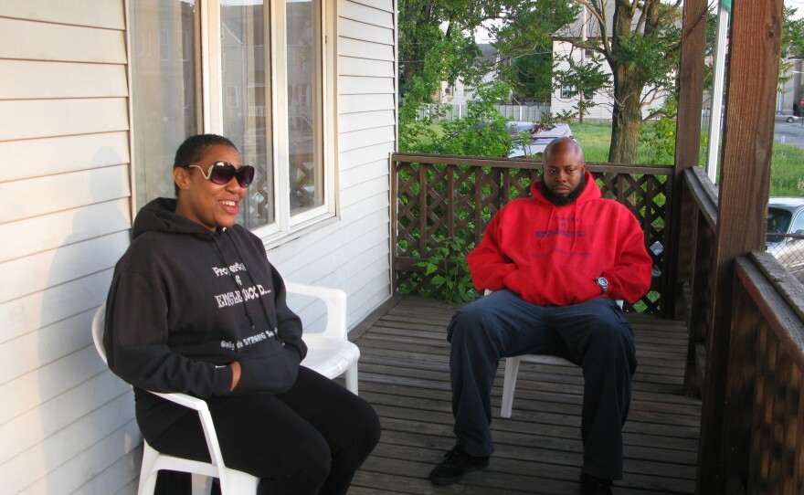 Asiaha Butler (left) of the Englewood neighborhood in Chicago was talking with Schaper when a man began shooting at a van down the street from her house.