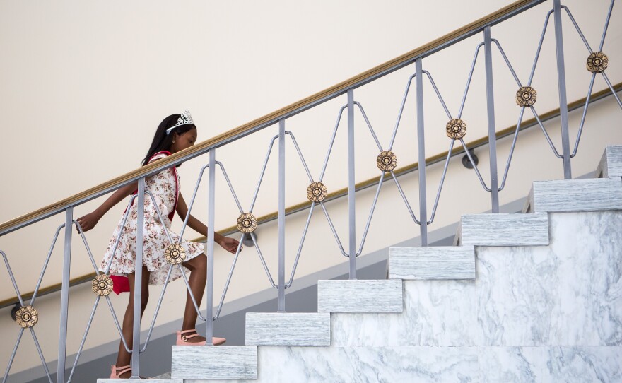 Tymia takes the stairs in the Rayburn House Office Building on her way to meet with Sanford. By the end of the day, she was using a wheelchair.