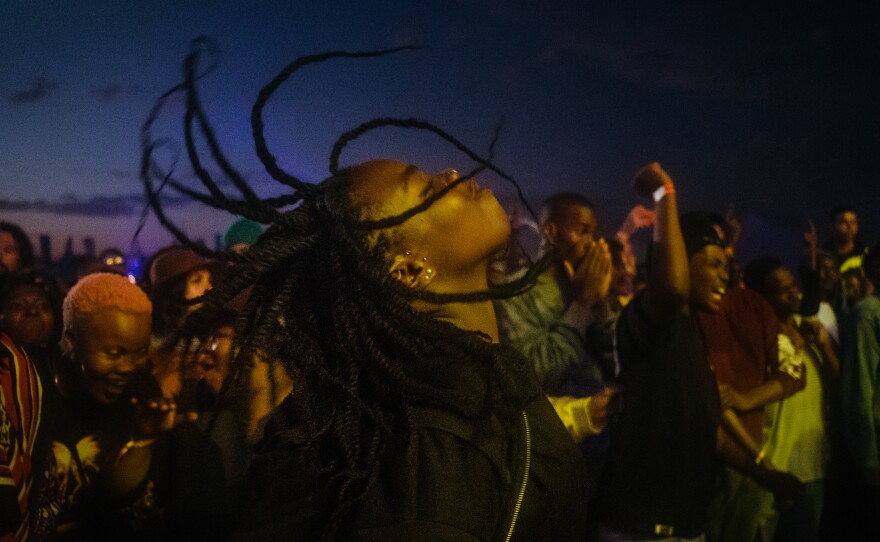 After hours of waiting, a festival attendee cuts loose in a mosh pit at the Afropunk Joburg festival in Johannesburg in December 2017.
