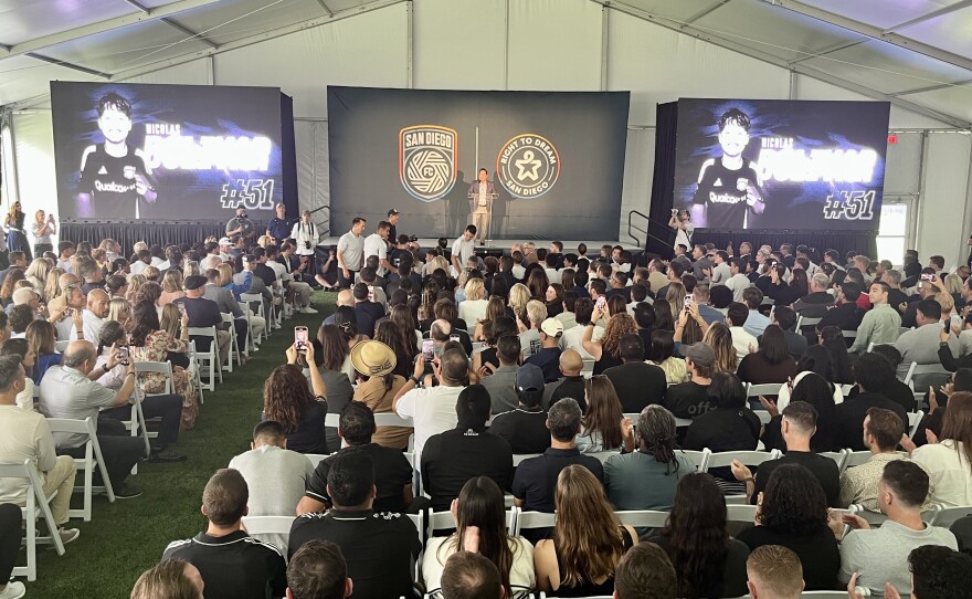 A crowd gathers inside of a tented hall for the opening of San Diego FC's Right to Dream Academy, Sept. 26, 2025.