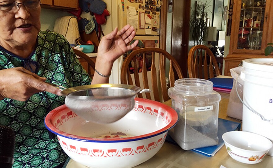 Lillie Pete sifts the juniper ash before adding it to her blue corn mush in this undated photo.
