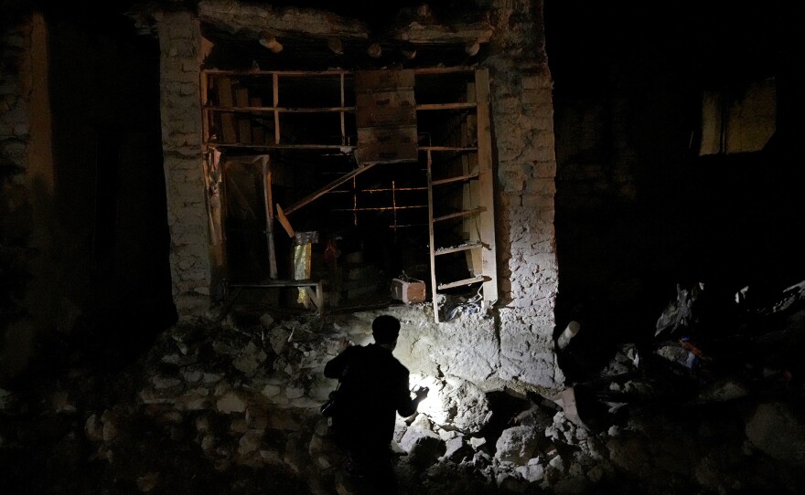 Afghans look for survivors in the village of Gyan, in Paktika province, Afghanistan, Wednesday, June 22, 2022.