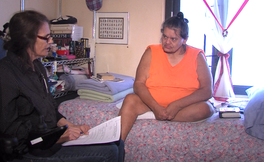 Colleen Gruber, a case worker with Father Joe's Villages, talks to her client, Juanita Broughman, who was formerly homeless but now lives in a permanent housing unit in San Diego's East Village, June 12, 2017.