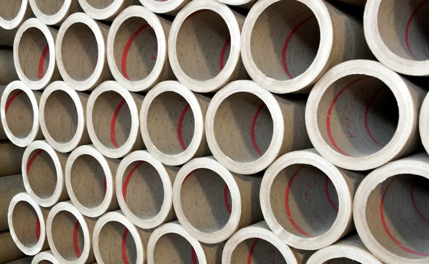 Giant rolls of paper stacked at the Sonoco Paper Mill, which is then used to make containers for products such as Pringles potato chips or Planters peanuts.