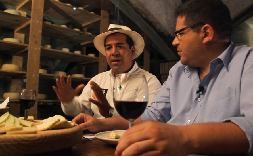 Marcelo Castro talks with host Jorge Meraz about the history of his cheese cellar called La Cava de Marcelo in Ojos Negros.