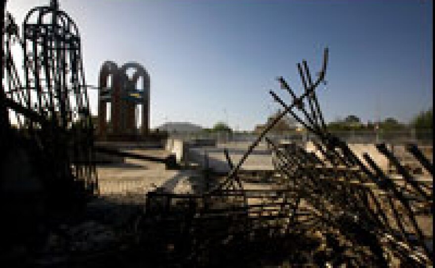 The remains of the Kandahar provincial council's front gate, destroyed by a suicide car bomb. Seven suicide bombers wearing Afghan National Army uniforms stormed the compound on April 1. Nineteen people died throughout the compound that day, including the seven attackers. The Taliban claimed responsibility for the attack.