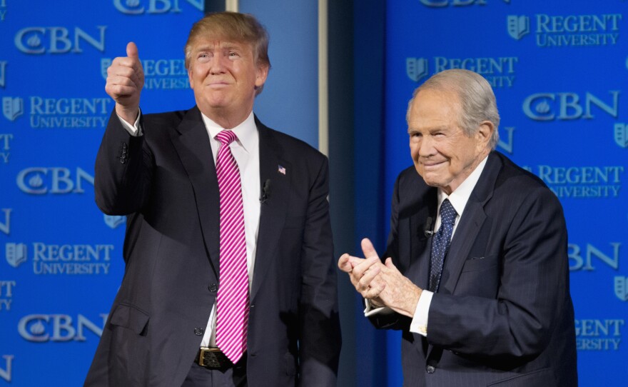 Republican presidential candidate Donald Trump is accompanied by Pat Robertson after speaking at Regent University in Virginia Beach, Va., in February 2016.