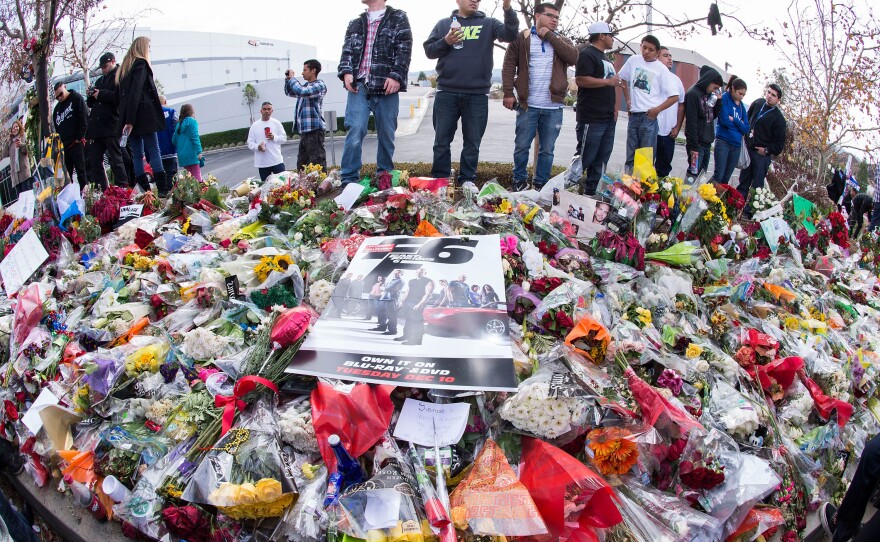 Fans pay tribute to Paul Walker at a memorial in Valencia, Calif., on Dec. 8, 2013.