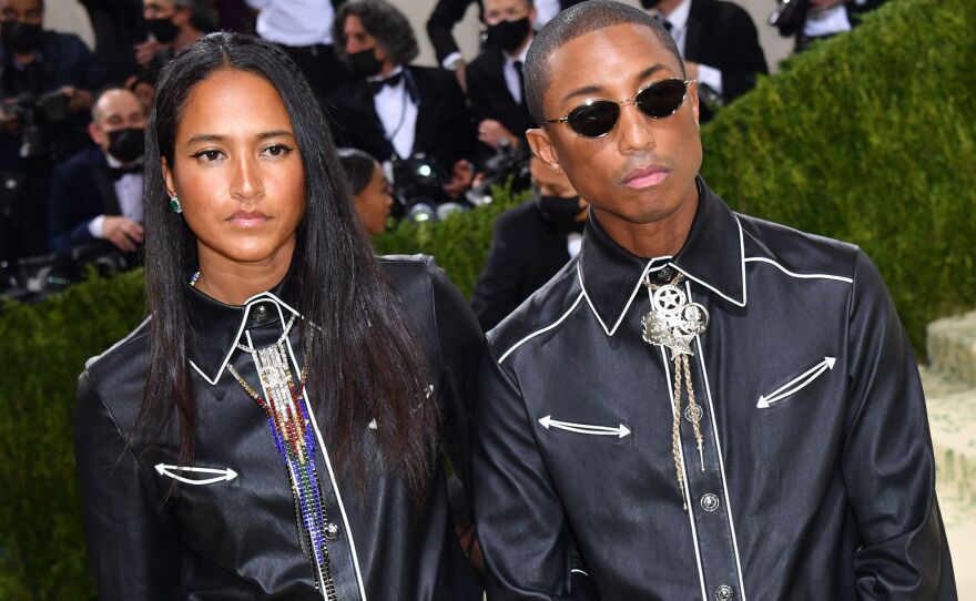 Helen Lasichanh and American musician and producer Pharrell Williams in a cowboy inspired outfit by Channel.